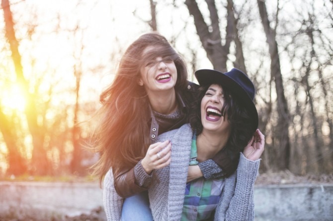 Two hipster friends goofing around